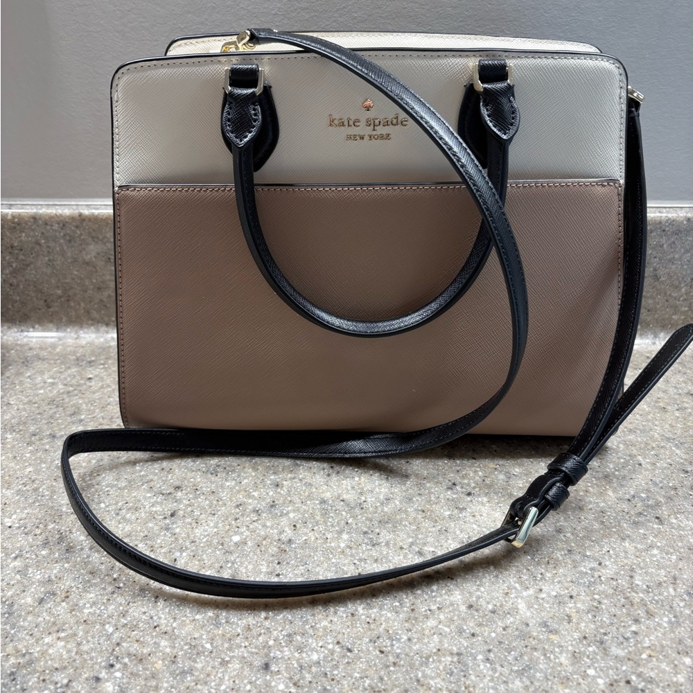 Chic Black and Cream Crossbody Bag with Gold Accents